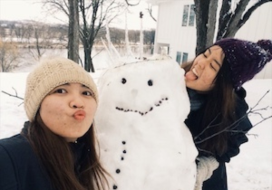Photo of my friend and I building a snowman